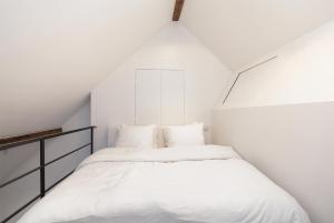 Postel nebo postele na pokoji v ubytování Pastoria Residence