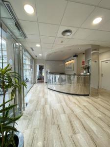 a lobby with a hardwood floor in a mall at Hotel Turissa in Tossa de Mar +37 photos