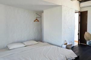 Postel nebo postele na pokoji v ubytování Sep'on Heartfulness Centre