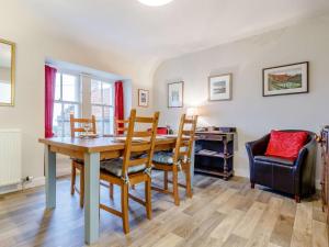 a dining room with a table and chairs at 2 Bed in Crail CA006 in Crail