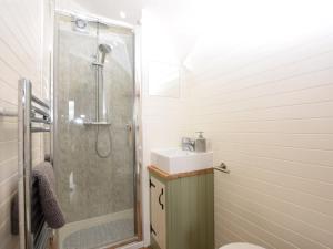 a bathroom with a shower and a sink at 1 Bed in Teviothead 75346 in Hawick