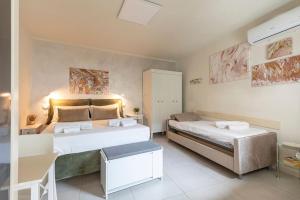 a large bedroom with two beds in a room at Tra Lago Maggiore e lago d'Orta Appartamento TERRA in Colazza
