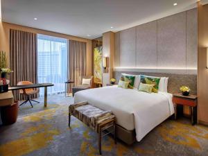 Sofitel Singapore City Centre客房内的一张或多张床位