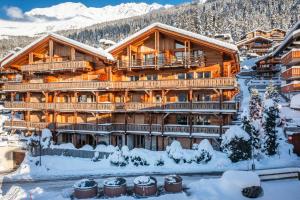 a lodge in the snow with snow at Ayous Verbier - BY EMERALD STAY in Verbier
