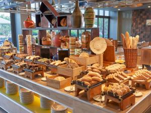 a bakery with lots of bread and pastries on display at Novotel Phu Quoc Resort in Phu Quoc