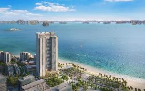 a view of a beach with a tall building and the ocean at Căn hộ khách sạn Alacarte Hạ Long in Ha Long