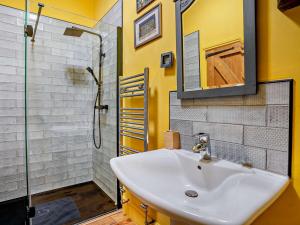 a bathroom with a sink and a shower at 4 Bed in Glasbury 80464 in Glasbury