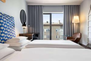 Posteľ alebo postele v izbe v ubytovaní Vienna House by Wyndham Andel's Cracow
