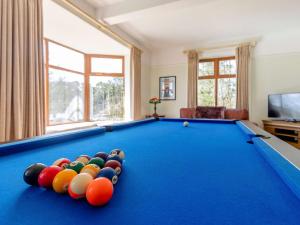 a pool table with balls on it in a living room at 5 bed in West Linton 81467 in West Linton