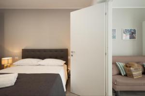 En eller flere senge i et værelse på Holiday House Vitruvian