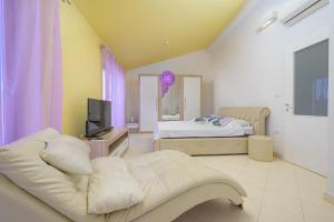 a living room with a couch and a bed at Villa Lana by IstriaLux in Vodnjan +39 photos