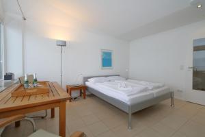 Ein Bett oder Betten in einem Zimmer der Unterkunft Haus am Meer14 - App. 159