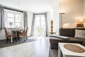 a living room with a couch and a table at App. Hegger Inselglück in Westerland (Sylt)