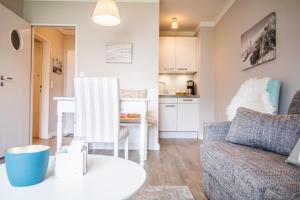 a living room with a couch and a table at App. Theo 50 in Westerland