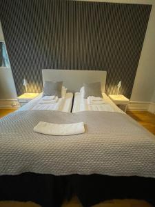 Postel nebo postele na pokoji v ubytování Lilla Hotellet