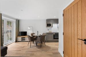 a kitchen and dining room with a table and chairs at Rock Mill 42 Middleton in Tideswell