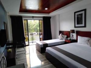 Postel nebo postele na pokoji v ubytování Hotel Gabriella