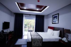 Postel nebo postele na pokoji v ubytování Hotel Gabriella