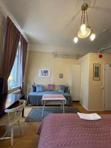 Postel nebo postele na pokoji v ubytování Lilla Hotellet