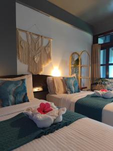 Postel nebo postele na pokoji v ubytování Daluyong Beach Resort + 37 fotografií