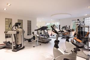 a gym with treadmills and elliptical machines at Landgoed de Rosep in Oisterwijk