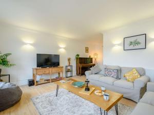 a living room with a couch and a table at 3 Bed in Kippford 88274 in Kippford