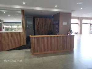 a lobby with a reception desk in a building at Lo de Ramón in San Carlos de Bariloche