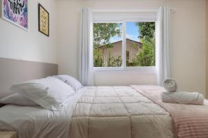 Postel nebo postele na pokoji v ubytování Toscano Cabernet 2 dorm by Achei Gramado