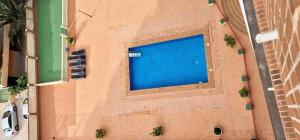 an overhead view of a large swimming pool on a building at Loixmar in Benidorm
