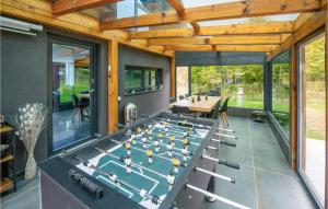 a room with a ping pong table in it at Amazing Home In Novo Zvecevo With House A Panoramic View in Novo Zvecevo