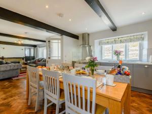a kitchen and dining room with a table and chairs at 3 Bed in Pooley Bridge 89068 in Tirril