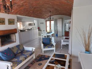 a living room with a couch and a table at Paters Haven Self-catering and B&B in Paternoster