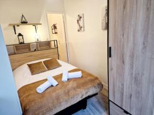 Postel nebo postele na pokoji v ubytování Le Flambart