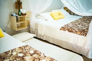 Postel nebo postele na pokoji v ubytování Pousada Portal da Concha