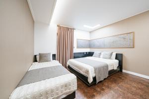 Postel nebo postele na pokoji v ubytování Major Hotel 2