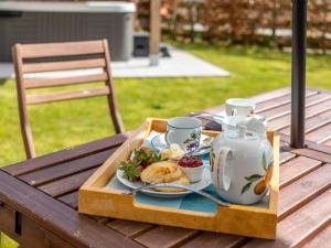 a tray with a tea set on a table at 2 Bed in Launceston 41992 in Saint Giles on the Heath