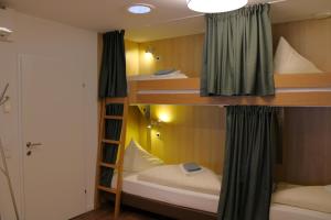 Poschodová posteľ alebo postele v izbe v ubytovaní Drei Türme Top 9