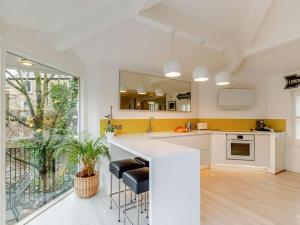 a kitchen with white counters and a large window at 3 Bed in Hayfield 54472 in Hayfield