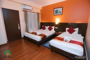 Katil atau katil-katil dalam bilik di Hotel Eco Tree Pokhara
