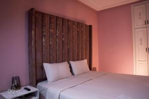 Postel nebo postele na pokoji v ubytování Aparthotel & Hotel Doha