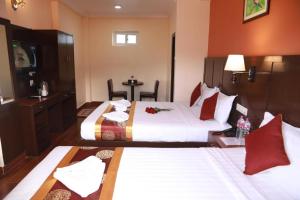 Katil atau katil-katil dalam bilik di Hotel Eco Tree Pokhara