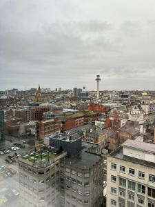 an aerial view of a city with a control tower at Stunning City View Apartment by Central Stay in Liverpool