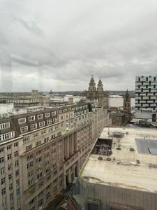 a view of a city with tall buildings at Stunning City View Apartment by Central Stay in Liverpool