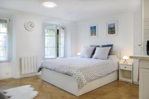 Postel nebo postele na pokoji v ubytování Studio proche Roland Garros + 10 fotografií