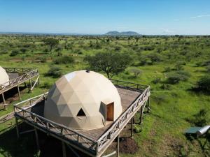 an overhead view of a dome tent in a field at Kuoom Serengeti in Robanda