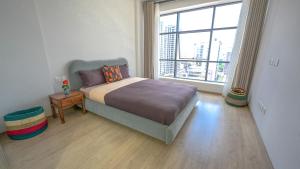 Postel nebo postele na pokoji v ubytování Elite One Bedroom Apartment,Swimming pool, gym, workspace ,Wonderiss Homes close proximity to GTC, JW Mariott and Kempinski