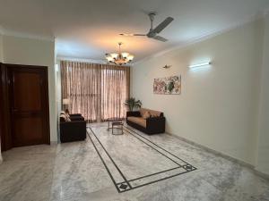 Posezení v ubytování Pamposh Guest House, Gurgaon