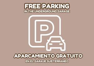un cartel que dice aparcamiento gratuito en el garaje subterráneo en Apartament Blanca, en La Mata