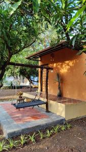 a porch of a house with a swing at Lalera stay in Chāndawāri