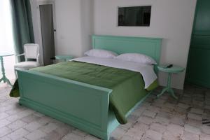 Ένα ή περισσότερα κρεβάτια σε δωμάτιο στο La Torretta